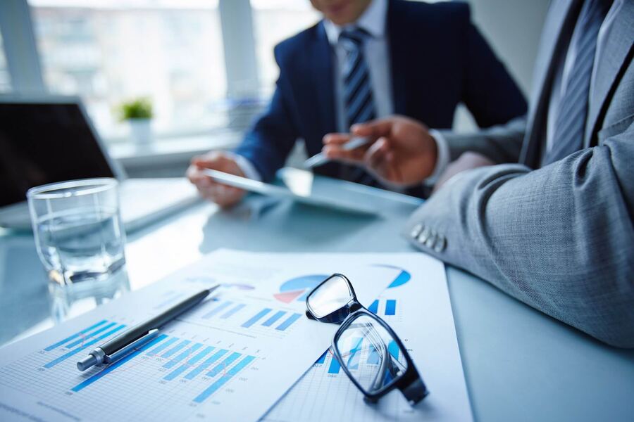 Executives reviewing marketing performance charts