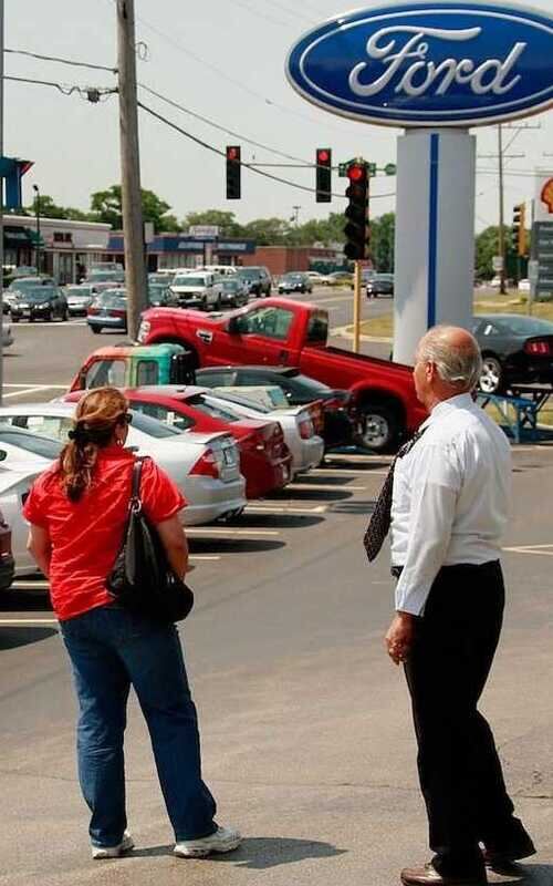 Vehicles lined up at a dealership